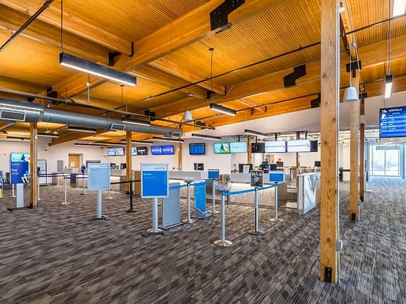 The check-in hall at Sonoma County Airport, with airline counters and queue lanes.